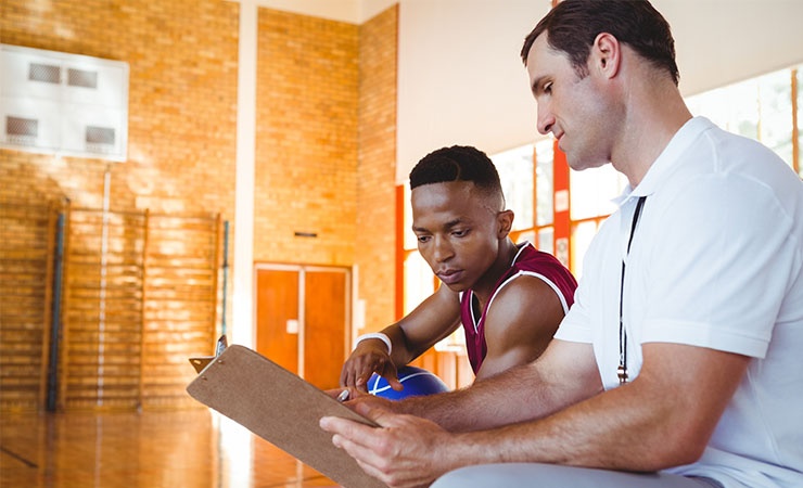 Coach talking to athlete