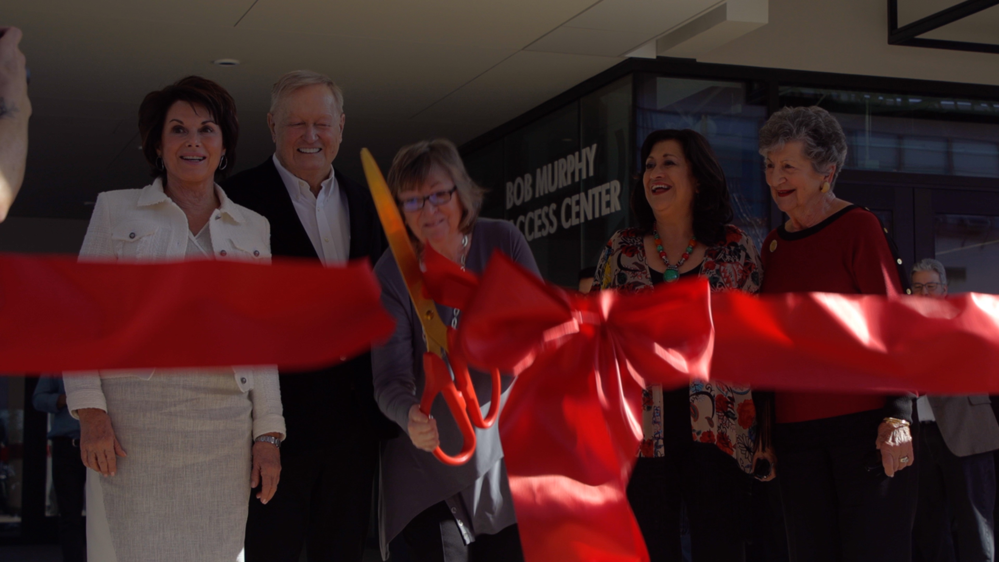 Jane Close Conoley cuts the ceremonial ribbon on the new Student Success Center.