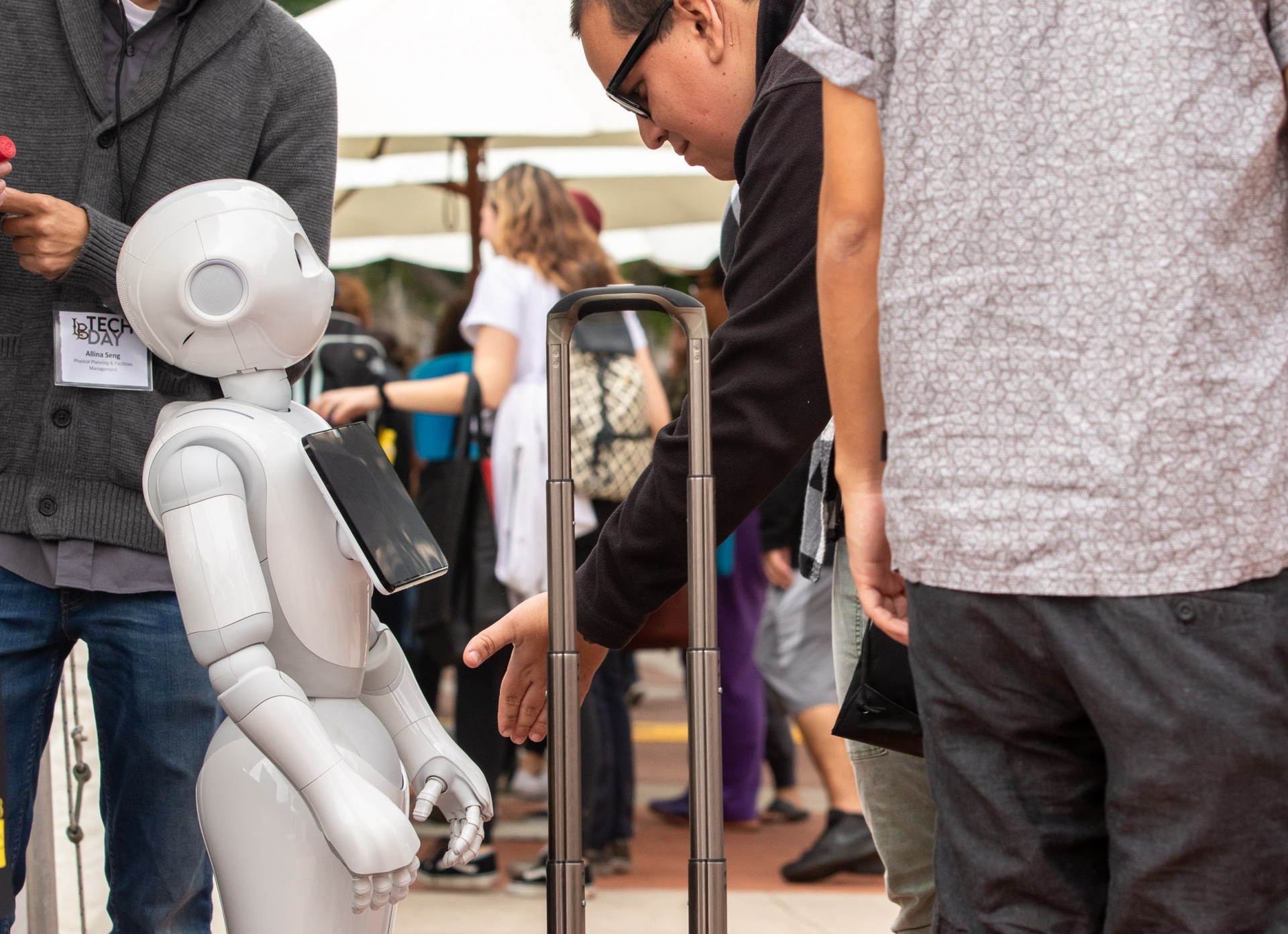 student interacting with robot