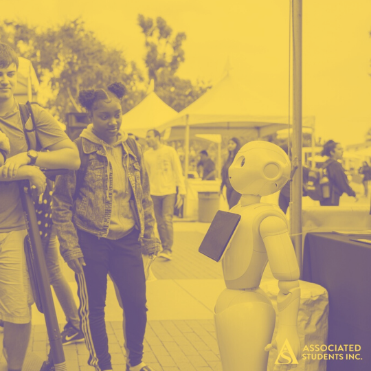 techday_mustard_transparency75.png Students looking at a robot at Tech Day