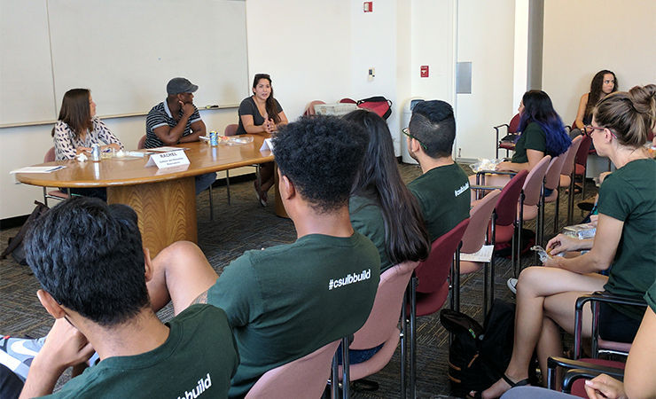 uci6.jpg CSULB BUILD Student listening to UCI faculty