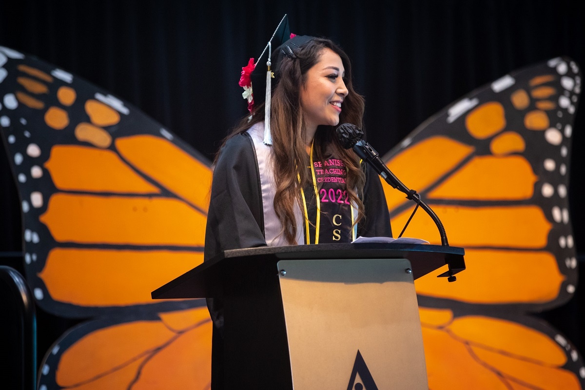 undocumented-02_rs.jpg A student speaks from the podium at the 2022 Undocumented Gr
