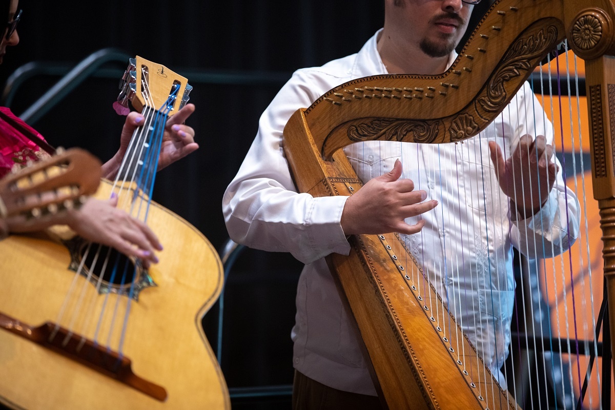 undocumented-03_rs.jpg Students play instruments at the 2022 Undocumented Graduatio