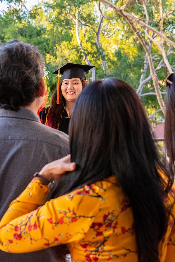 vietnamese_8_rs.jpg A family photographs at grad at the 2022 Vietnamese Cultural
