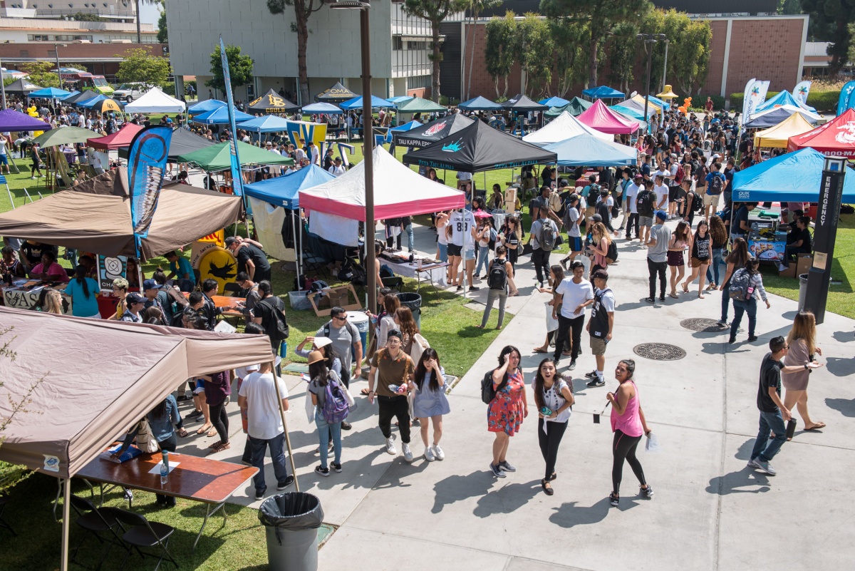 Students crowd the quad to check out various clubs, organiza