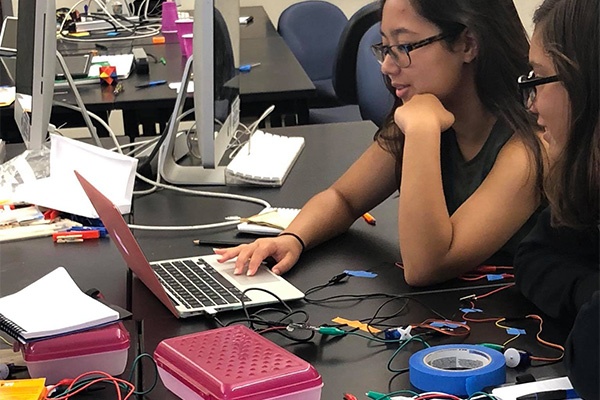 girls programming small connected devices