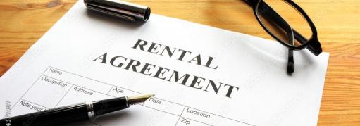 rental agreement and pen for signature