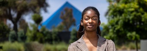 Student Chloe Thomas, an inaugural recipient of the Black Student Success Scholarship, with Walter Pyramid in background