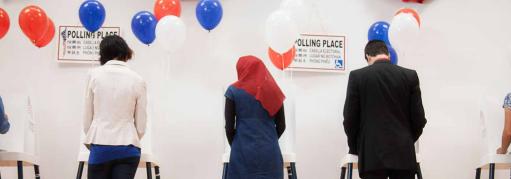 Group of voters filling out ballets