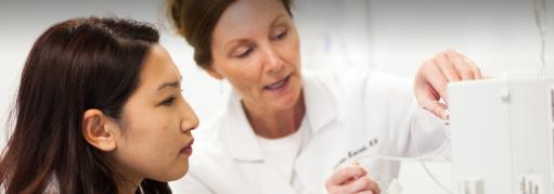 A student works with an instructor in the College of Health and Human Services