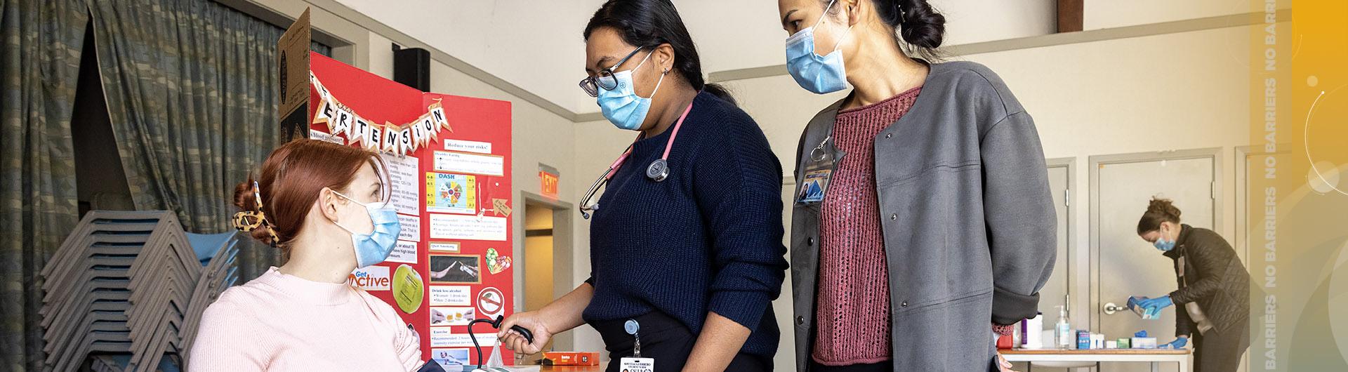 student nurse takes blood pressure