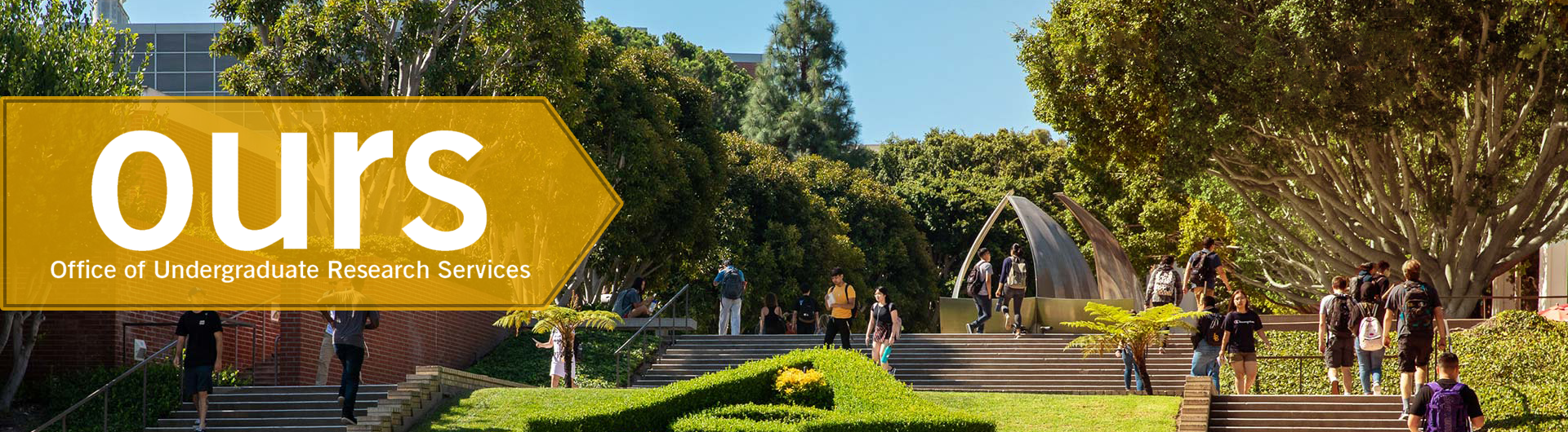 Students walking on Stairs with OURS Logo