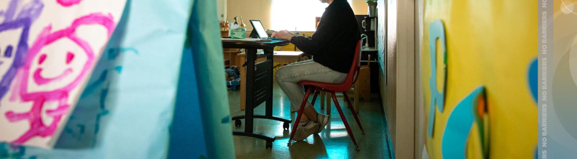 Teacher sitting in a classroom