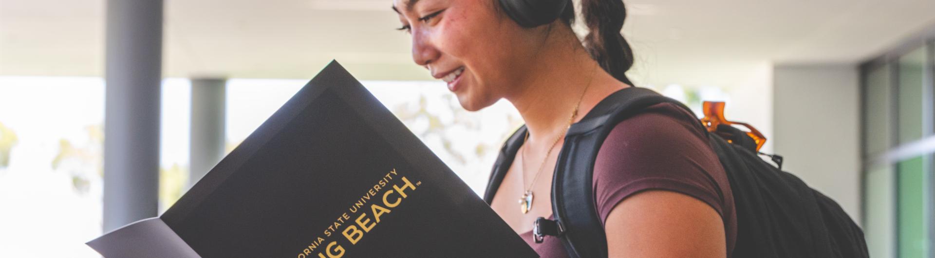 A student looks over her Beach XP folder on the first day of classes. 