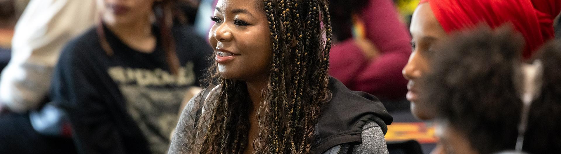 Banner image of admitted student during 'Day at the Beach' welcome ceremony
