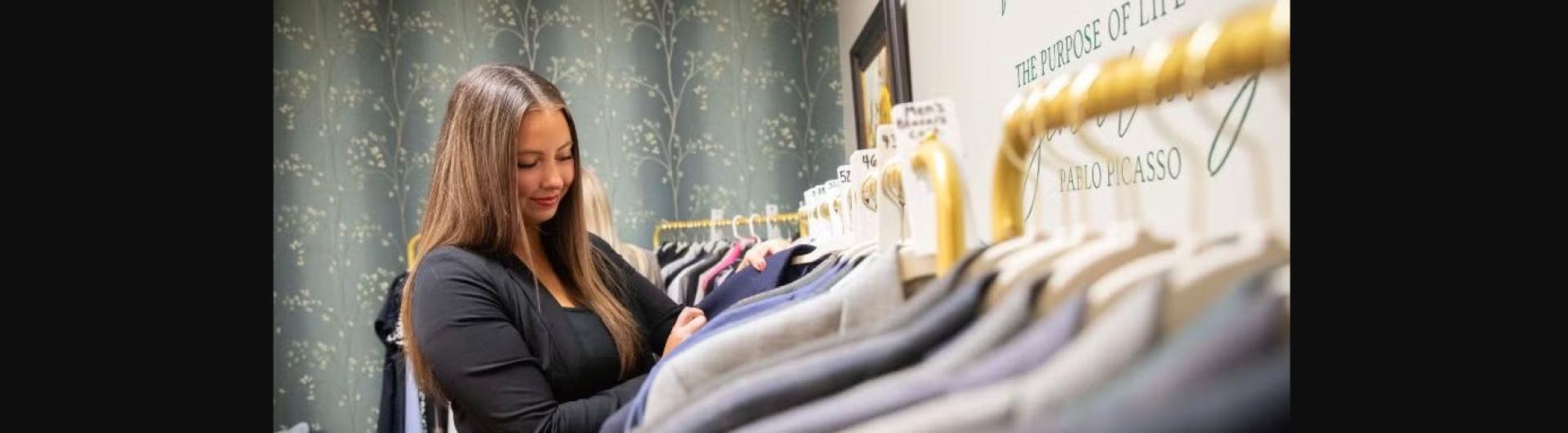 person looking at clothes