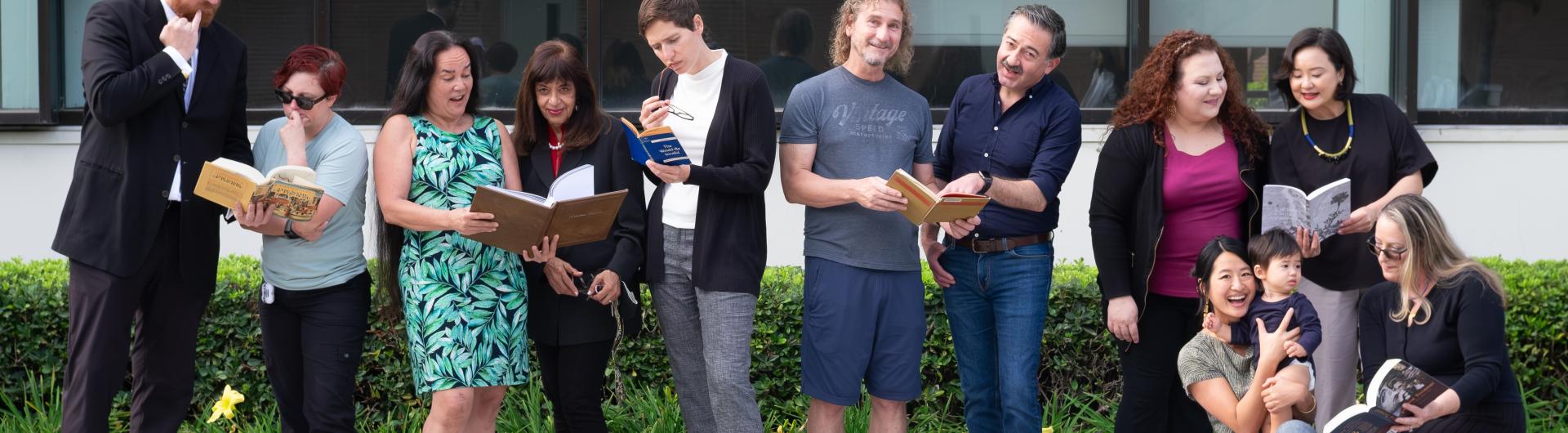 group of people looking at books and other things
