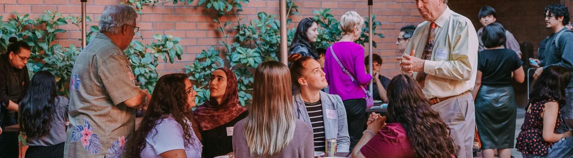 Attendees at fall mixer 2025 in COB patio