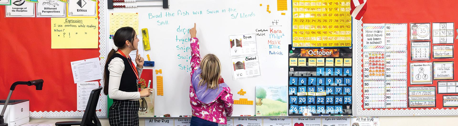 Student teacher Marlee Aguirre instructs elementary school student
