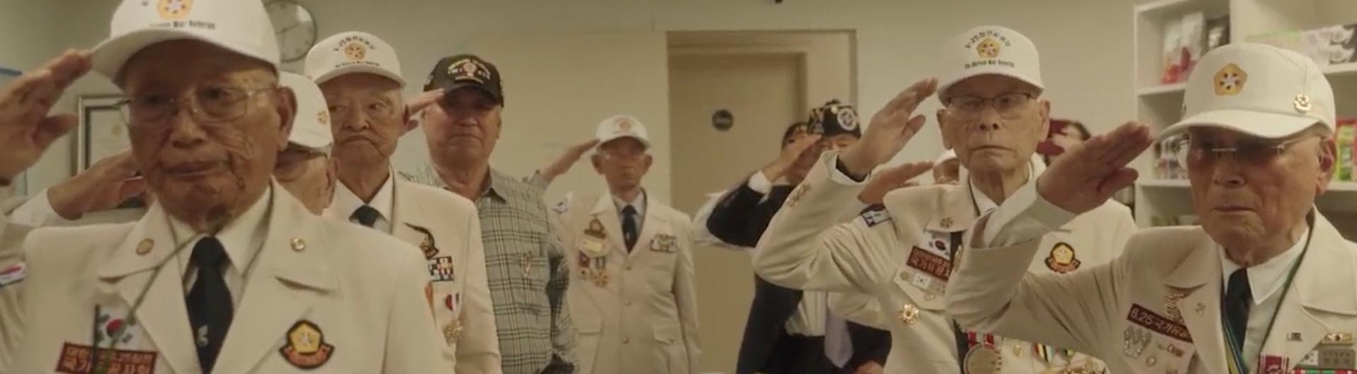 Korean War Veterans Stand at Attention and Salute