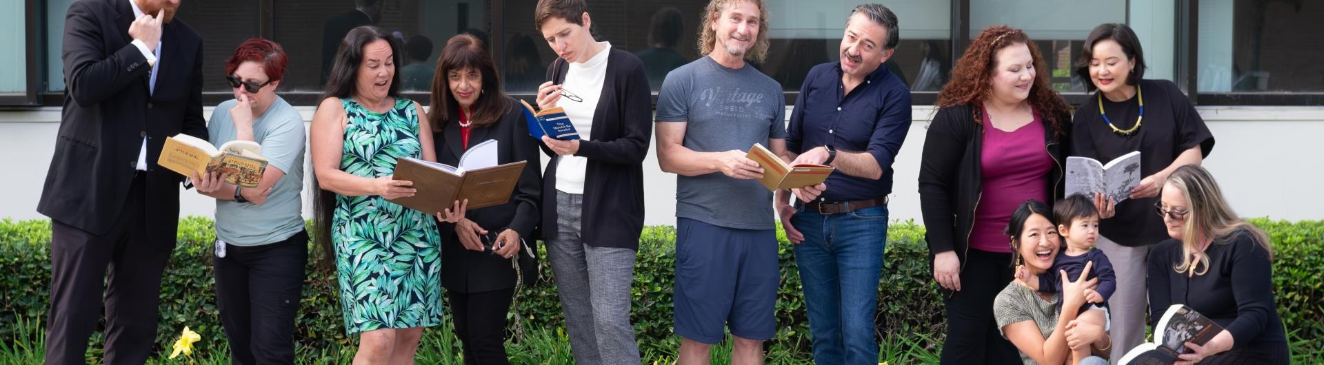 people looking at books and things with a baby