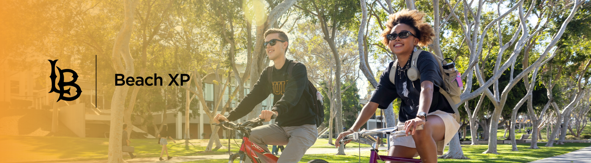 Two students riding bikes together. On the left of the image is the Beach XP logo.