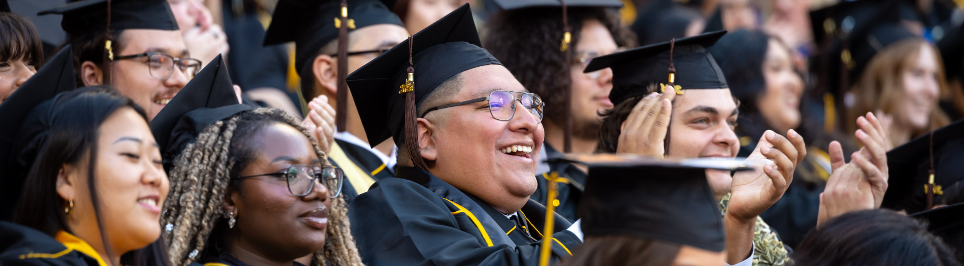 a group of students wearing graduation caps and gowns