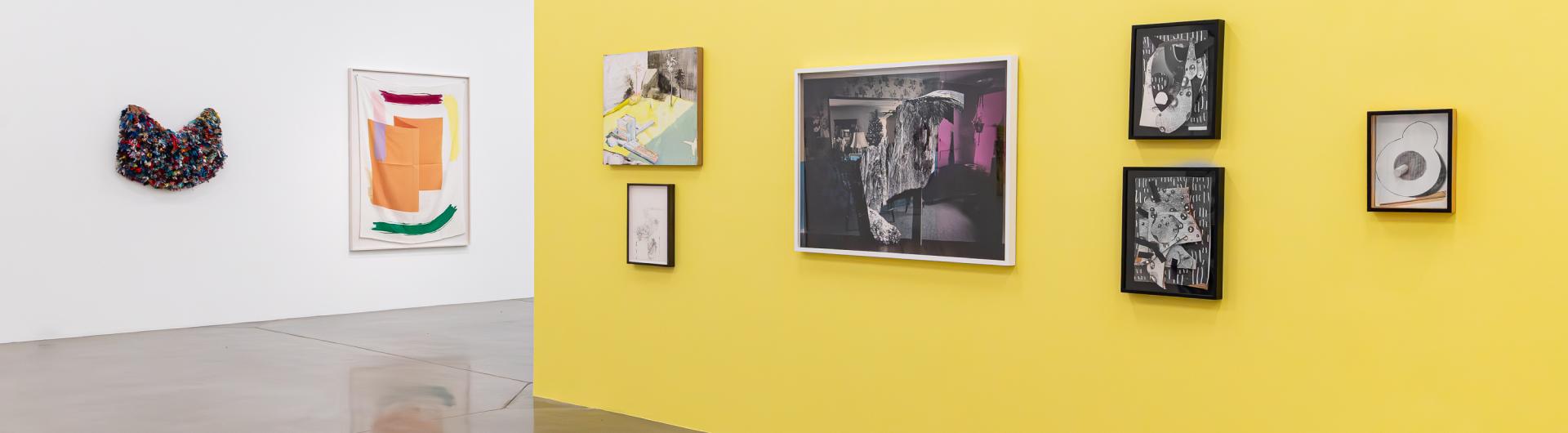 Multiple art pieces shown in the university art museum