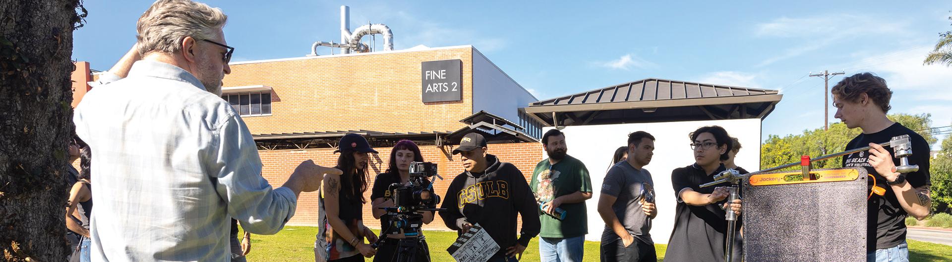 Professor Kent Hayward, left, leads students in sustainable filmmaking
