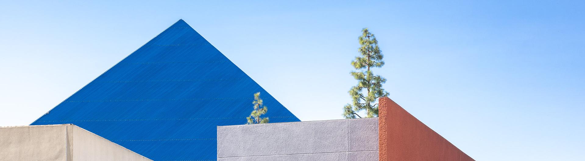 Blue pyramid against blue sky