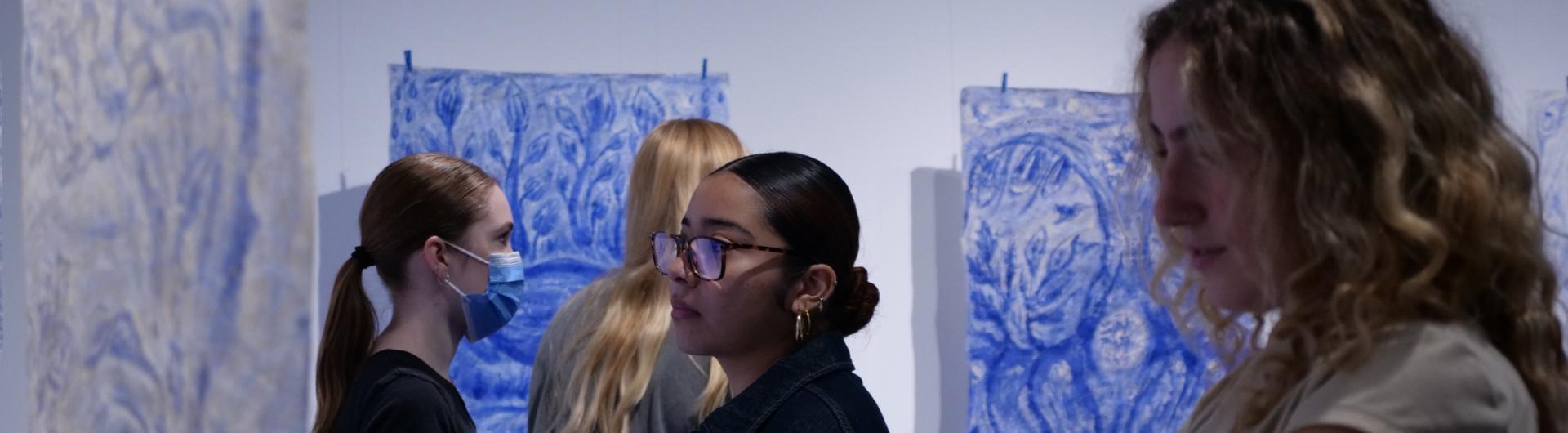 Students looking at artwork