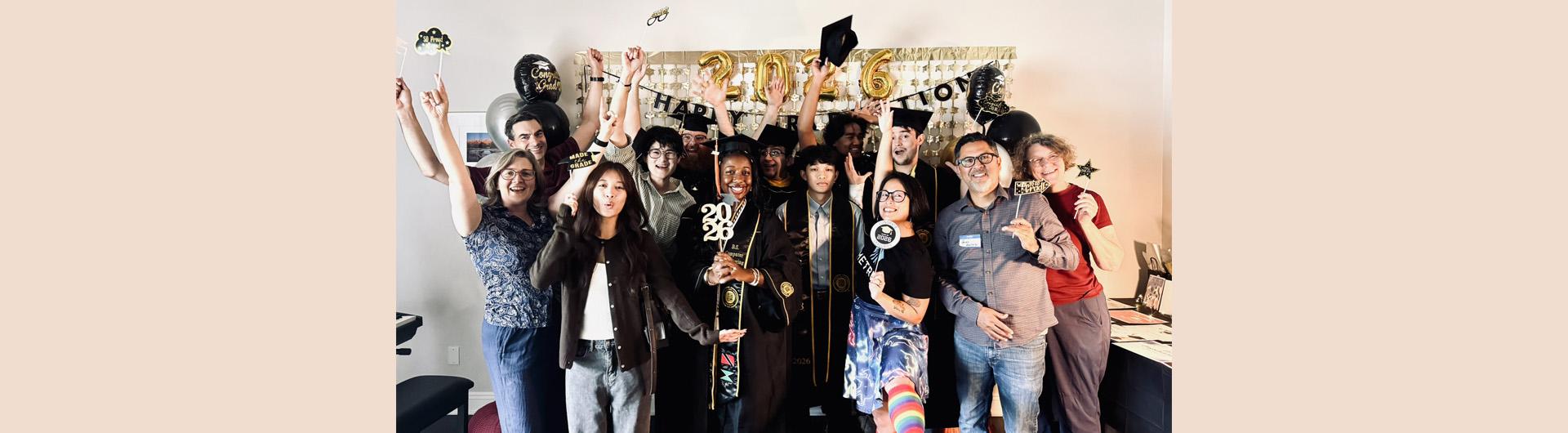 graduates, mentors, friends, and family at the celebration