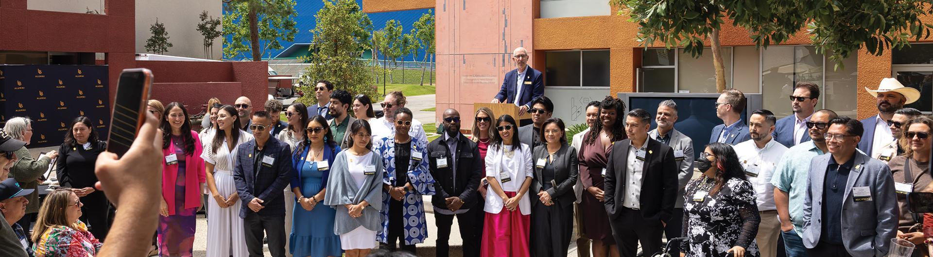 group of 2026 49 under 49 recipients posing for a photograph