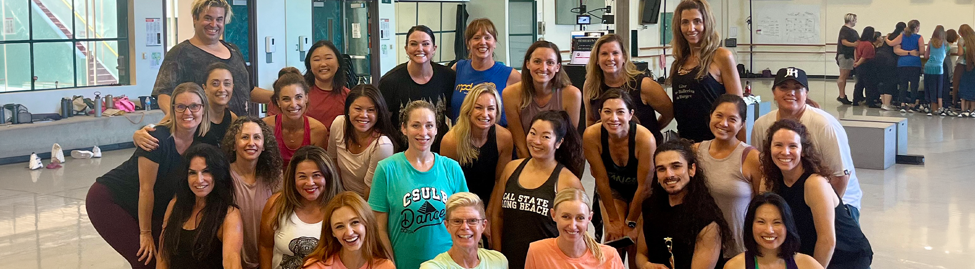 A group of Masters Pro Dance Workshop participants pose for a group photo.