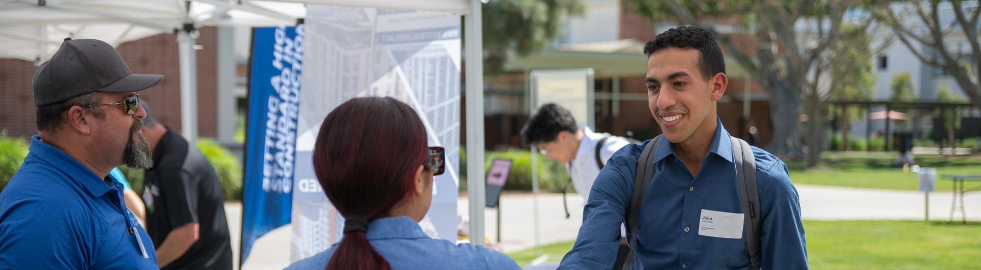 Student at a job fair web banner.