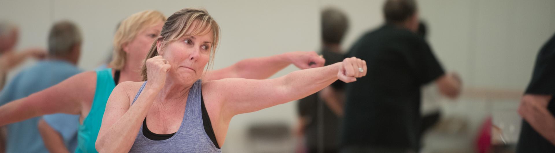 Woman exercising in class