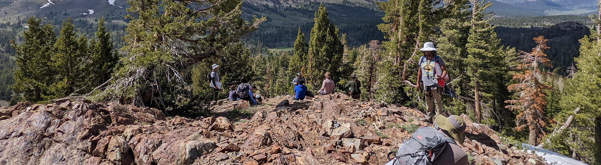 Students and instructors standing on a mountain top in the Sierra Nevada Mountains.