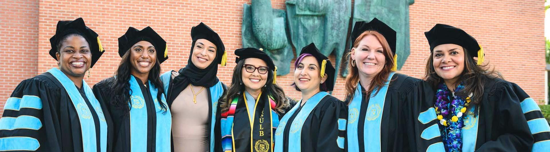 Educational doctorate students pose at graduation