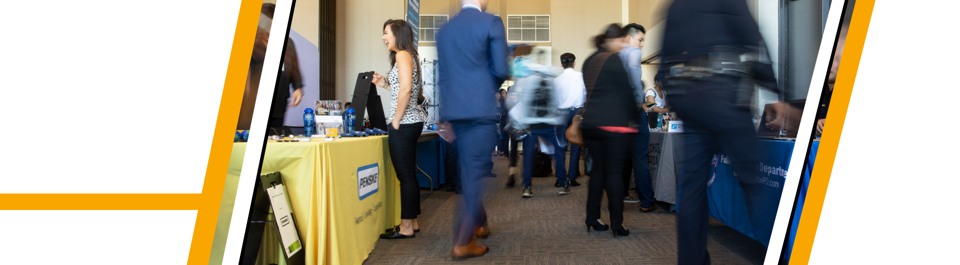 picture of student at job fair talking to employer