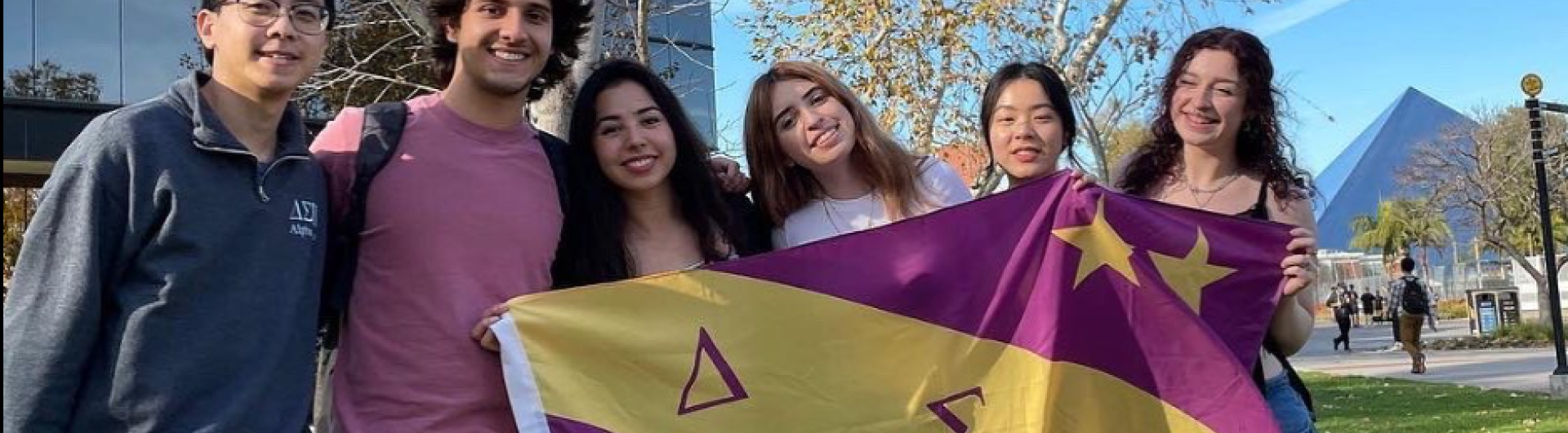 Students and Flag of Delta Sigma Pi - CSULB 2022