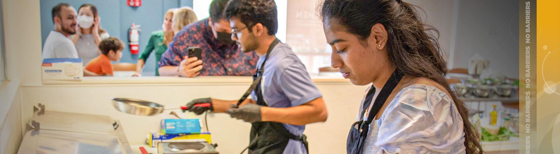 Students prepare food in Beach Kitchen