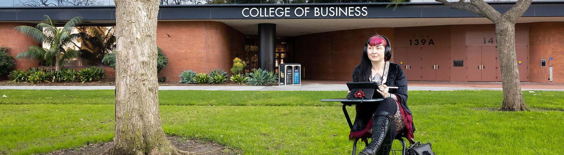 Student Laura Bush works on computer in front of COB