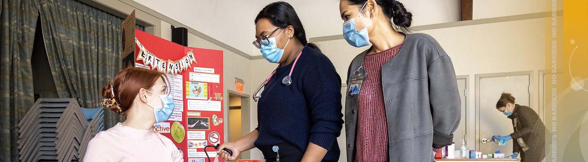 student nurse takes blood pressure