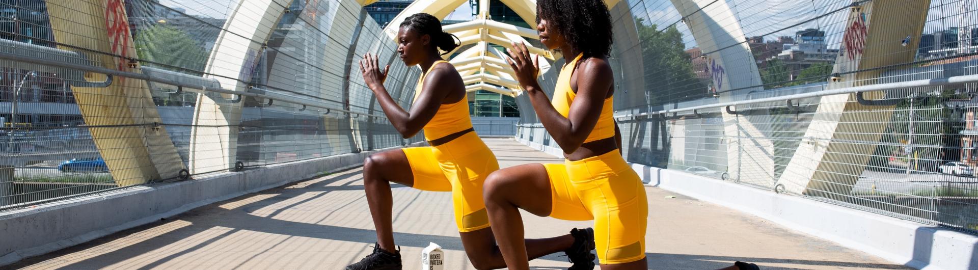 two women doing lunges