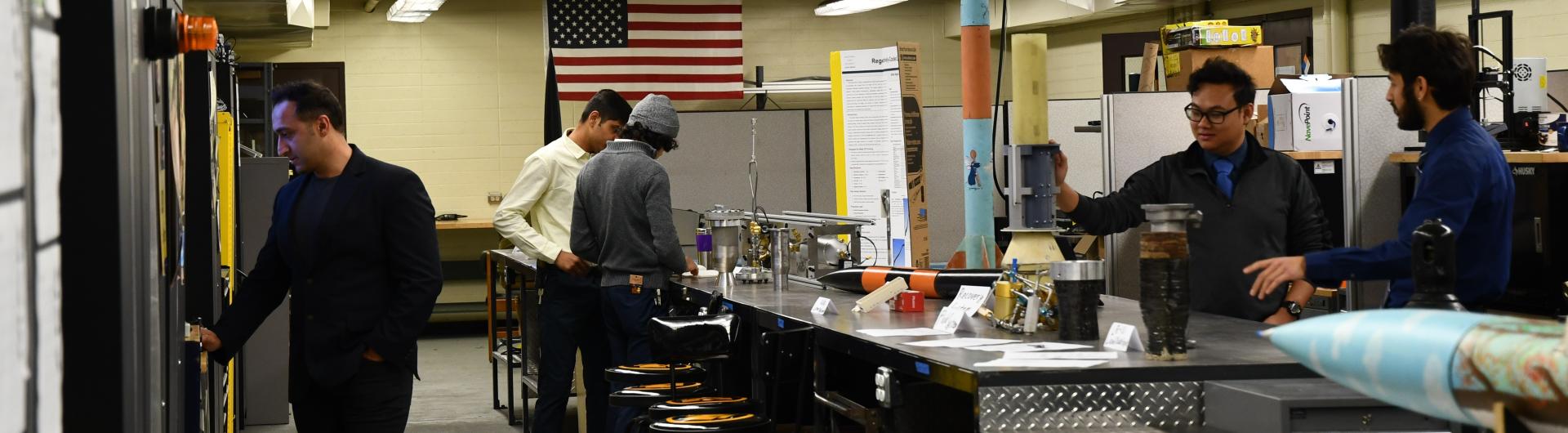 Students from CSULB Rocket Lab display their rockeets