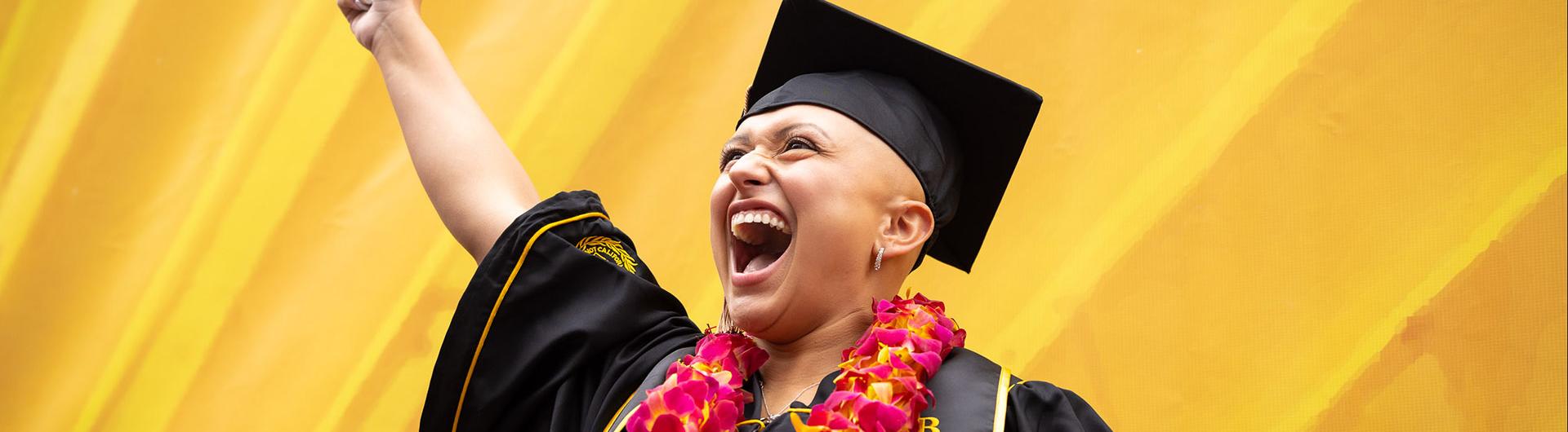 Grad raises index finger in celebration