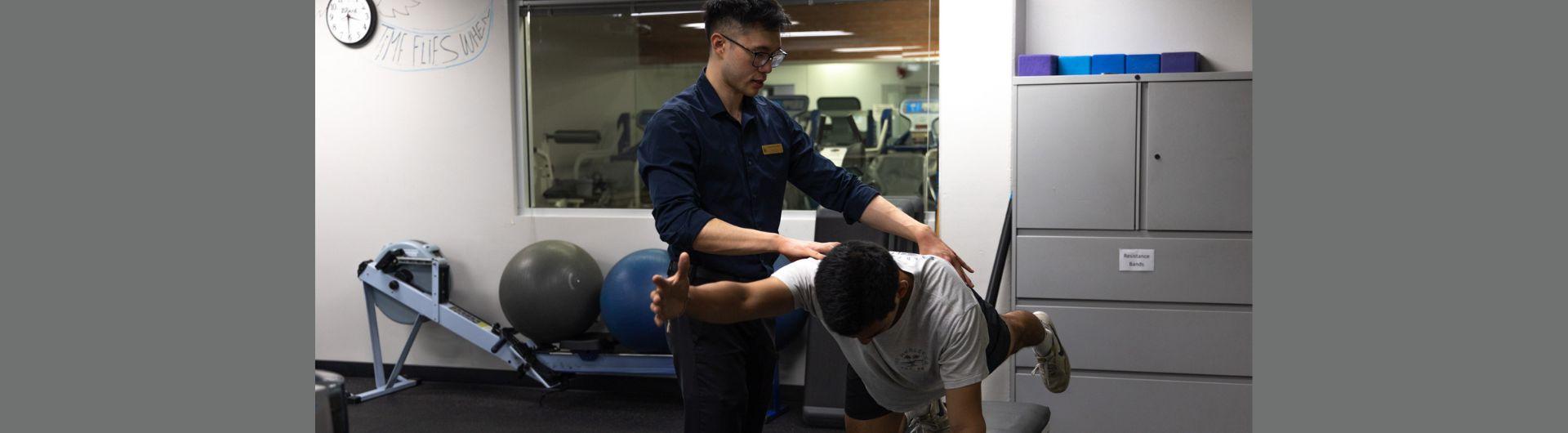 physical therapist working on patient