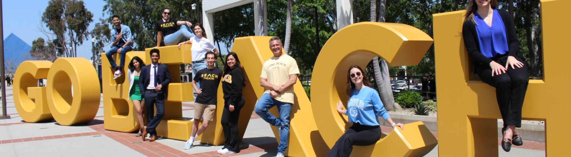 picture of students in front of the Go Beach sign at CSULB