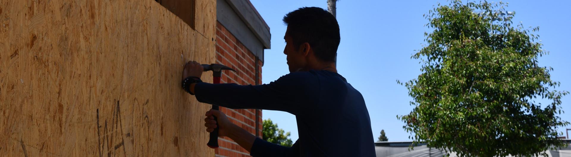 Student building tiny-home senior project