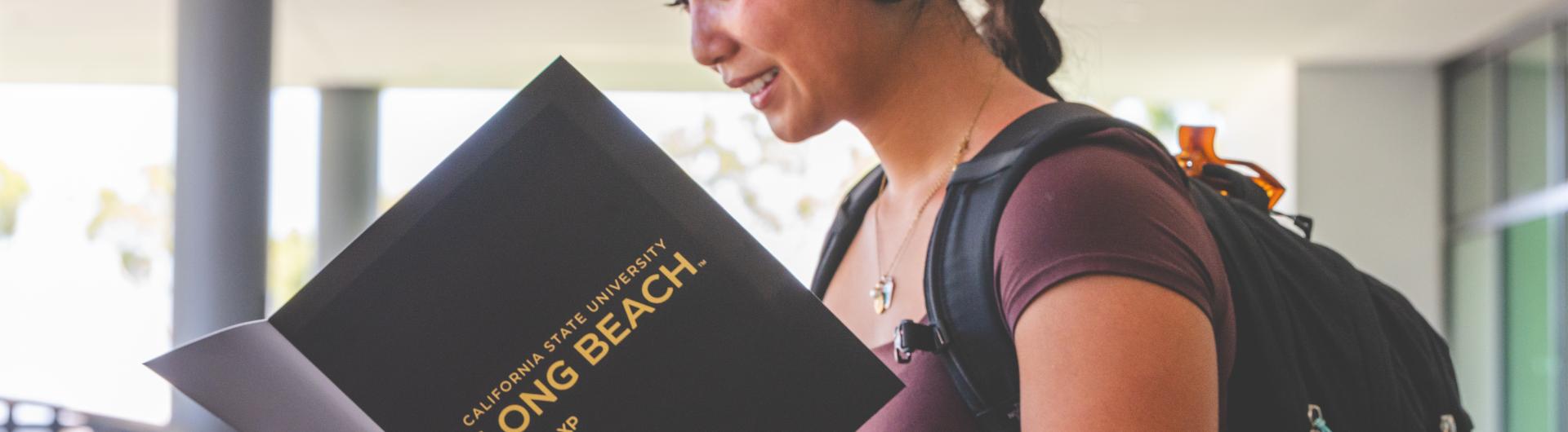 A student looks over her Beach XP folder on the first day of classes. 